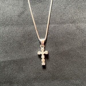 Sterling silver CZ cross pendant.